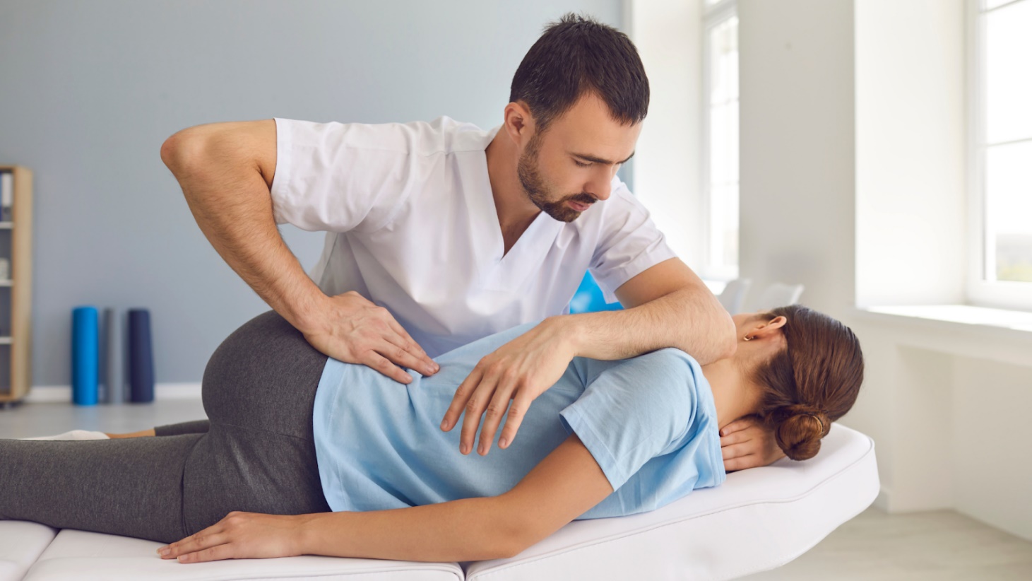 chiropractor massaging a woman